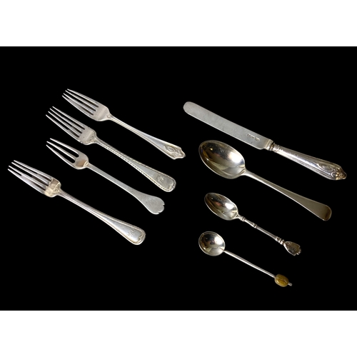 60 - A collection of Silver flatwares. Includes four silver forks, a spoon, knife and two teaspoons. All ... 