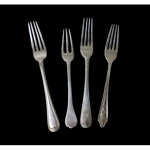 60 - A collection of Silver flatwares. Includes four silver forks, a spoon, knife and two teaspoons. All ... 