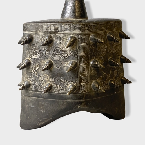 201 - A Chinese Archaic type Bronze bell (Yong Zhong).
With conical shape bosses and scrolling stylised de... 