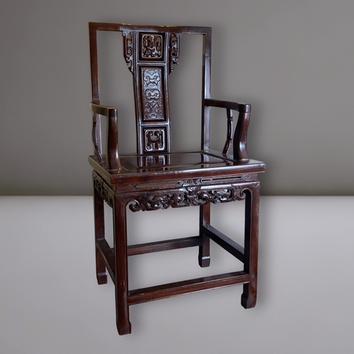 206 - A CHINESE CARVED HARDWOOD ARMCHAIR, 20TH CENTURY. The splat carved with a figure and pierced apron. ... 