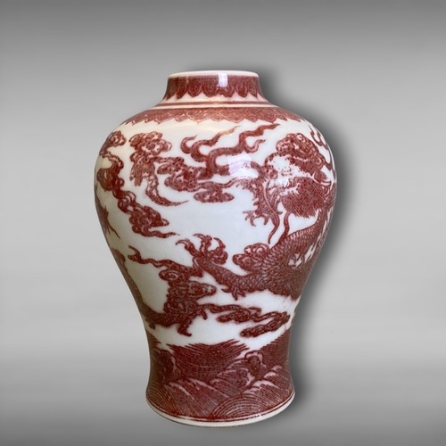 209 - A Chinese Copper Iron-red porcelain Vase. Painted Five-claw Dragons chasing a pearl amongst clouds, ... 