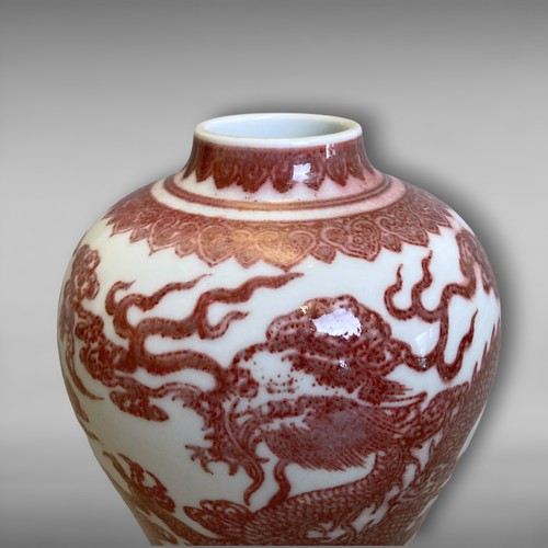 209 - A Chinese Copper Iron-red porcelain Vase. Painted Five-claw Dragons chasing a pearl amongst clouds, ... 