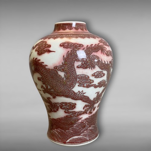 209 - A Chinese Copper Iron-red porcelain Vase. Painted Five-claw Dragons chasing a pearl amongst clouds, ... 