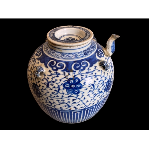 213 - A large Chinese Qing dynasty porcelain Wine / Water pot. 
Hand painted with scrolling stylised bloss... 