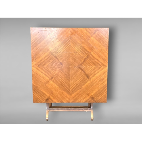 16 - AN ART DECO VENEERED FOLDING COFFEE TABLE.
64 X 51.5CM (FOLDED)