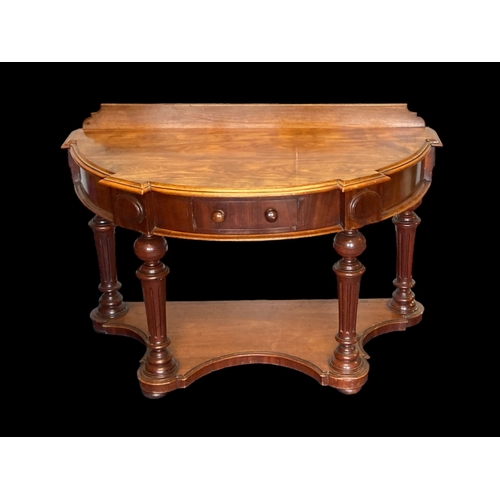 17 - A VICTORIAN MAHOGANY DEMI-LUNE CONSOLE TABLE. CARVED BALL LEGS WITH SINGLE FRIEZE DRAWER.