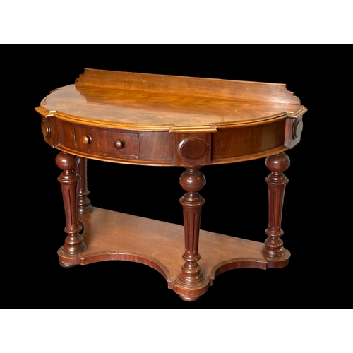 17 - A VICTORIAN MAHOGANY DEMI-LUNE CONSOLE TABLE. CARVED BALL LEGS WITH SINGLE FRIEZE DRAWER.