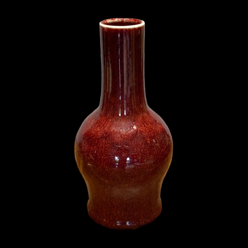 158A - A QING DYNASTY CHINESE SANG DE BOEUF FLAMBE GLAZE BOTTLE VASE.
33CM TALL.