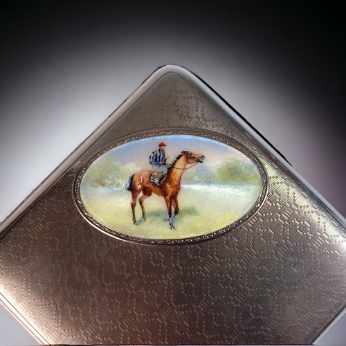 28 - A VINTAGE STERLING SILVER & ENAMEL 'RACEHORSE' CIGARETTE CASE. GILDED INTERIOR AND CABOCHAN BUTTON.
... 