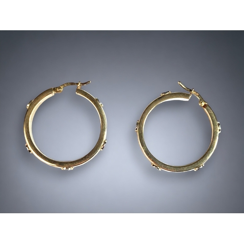 36 - A 9CT GOLD HOOP EARRINGS, IN THE CARTIER LOVE STYLE.
30MM