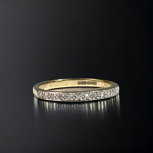 44 - A 9CT GOLD LADIES DIAMOND 1/2 ETERNITY RING. 
SIZE P.