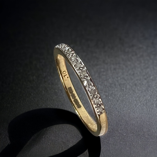 44 - A 9CT GOLD LADIES DIAMOND 1/2 ETERNITY RING. 
SIZE P.