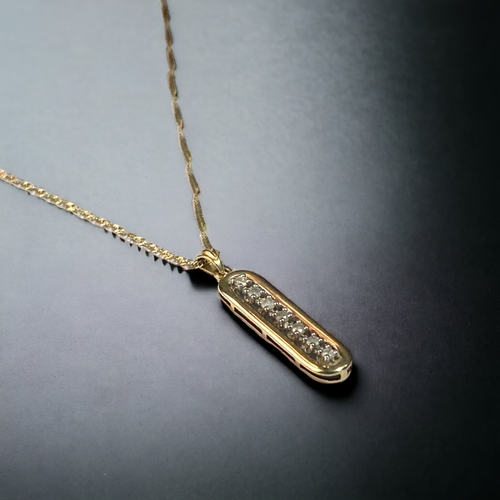 46 - A 9CT GOLD & DIAMOND PENDANT NECKLACE.
PENDANT - 30MM LONG.