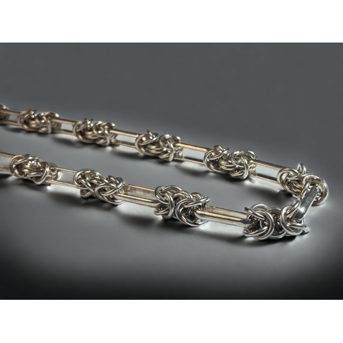 65 - A 925 SILVER FANCY KNOT NECK CHAIN. 
40CM LONG.
57G