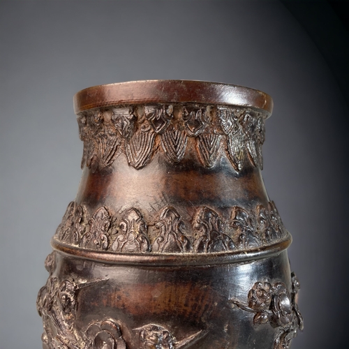 165 - A CHINESE CAST BRONZE VASE.
RELIEF DECORATED WITH BIRDS ON ROCK & CHERRY OUTCROPS. 
SIGNED TO BASE.
... 