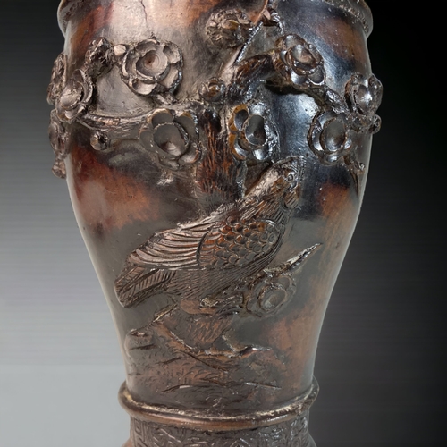 165 - A CHINESE CAST BRONZE VASE.
RELIEF DECORATED WITH BIRDS ON ROCK & CHERRY OUTCROPS. 
SIGNED TO BASE.
... 