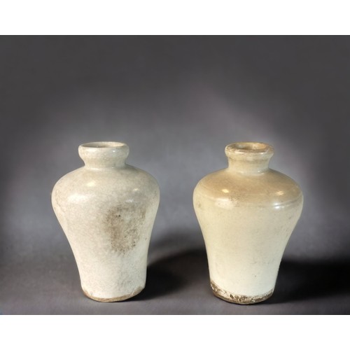 118 - TWO CHINESE FUJIAN TYPE WHITE GLAZE MINIATURE VASES. MEIPING SHAPE. 
POSSIBLY MING DYNASTY
9.5CM TAL... 