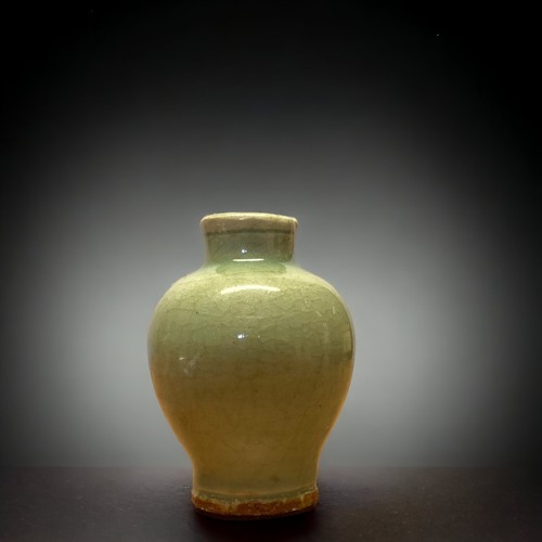 130 - A CHINESE GUAN CELADON MINIATURE VASE.
PROBABLY SOUTHERN SONG DYNASTY. MEIPING (PLUM) SHAPE.
10.5CM ... 