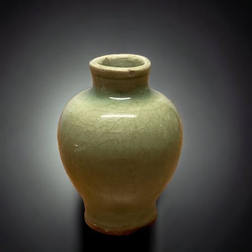 130 - A CHINESE GUAN CELADON MINIATURE VASE.
PROBABLY SOUTHERN SONG DYNASTY. MEIPING (PLUM) SHAPE.
10.5CM ... 