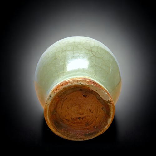 130 - A CHINESE GUAN CELADON MINIATURE VASE.
PROBABLY SOUTHERN SONG DYNASTY. MEIPING (PLUM) SHAPE.
10.5CM ... 