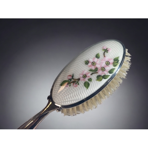 95 - TWO GUILLOCHE ENAMEL HAND MIRRORS TOGETHER WITH SIMILAR HAIR BRUSH.