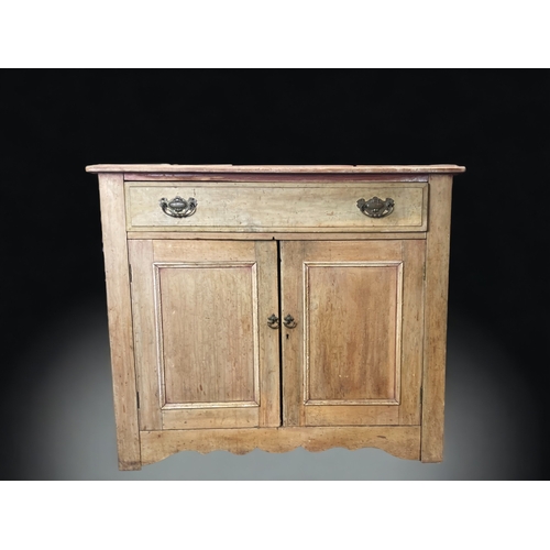 10 - A VINTAGE WAXED PINE CUPBOARD. 
WITH SINGLE DRAWER AND TWO DOORS.