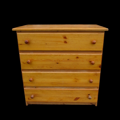 15 - A PINE FOUR DRAWER CHEST OF DRAWERS.