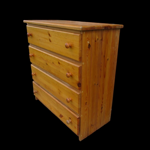 15 - A PINE FOUR DRAWER CHEST OF DRAWERS.