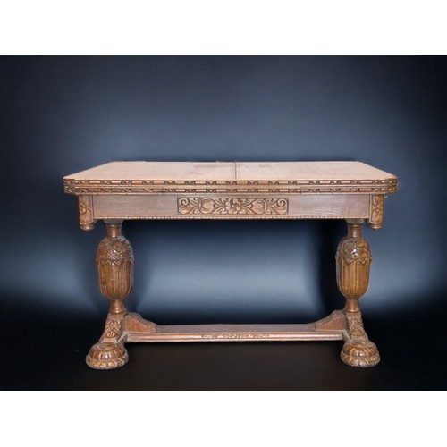 16 - A VICTORIAN CARVED OAK EXTENDING DINING TABLE.