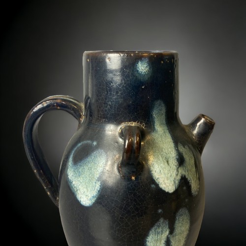 148 - A Chinese Lushan phosphatic black-splashed ground glazed ewer. 
Tang dynasty.
23cm Tall.