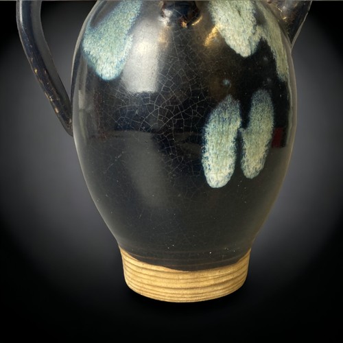 148 - A Chinese Lushan phosphatic black-splashed ground glazed ewer. 
Tang dynasty.
23cm Tall.