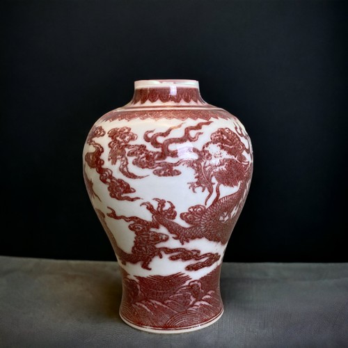 149 - A Chinese Copper Iron-red porcelain Vase. Painted Five-claw Dragons chasing a pearl amongst clouds, ... 