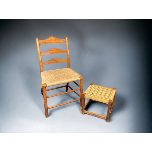 10A - A 19TH CENTURY ELM RUSH SEATED LADDER BACK CHAIR, TOGETHER WITH A RUSH WOVEN FOOTSTOOL. MAKERS MARK ... 