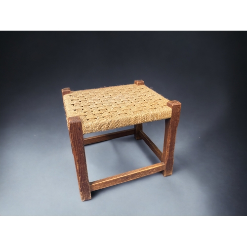 10A - A 19TH CENTURY ELM RUSH SEATED LADDER BACK CHAIR, TOGETHER WITH A RUSH WOVEN FOOTSTOOL. MAKERS MARK ... 