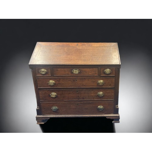 14 - A GEORGIAN OAK BUREAU. CURVED ARC COLUMNS AND BRASS HANDLES. FITTED DRAWER & PIGEON HOLE INTERIOR.
9... 