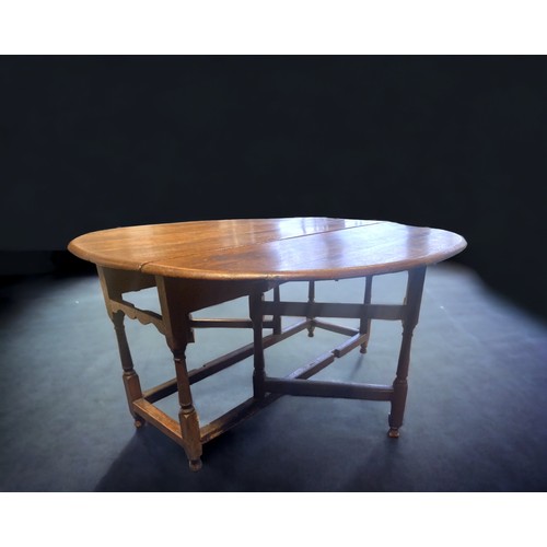 13 - A Large Georgian Oak Gate leg (Drop-leaf) table. 1.45metres x 1.4 metres