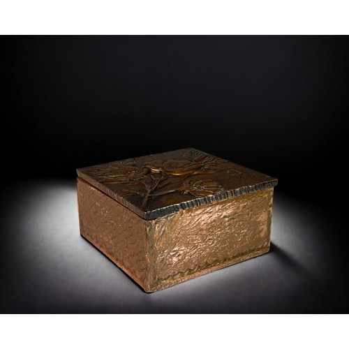 111 - AN ARTS & CRAFTS COPPER BOX.
HIGH RELIEF DECORATED FOLIATE DESIGN. 
ENGRAVED 