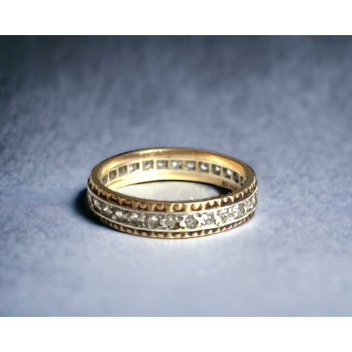 88 - A 9 carat gold & Diamond full eternity ring. 
Yellow & white gold band set with diamonds. 
Marked 9K... 