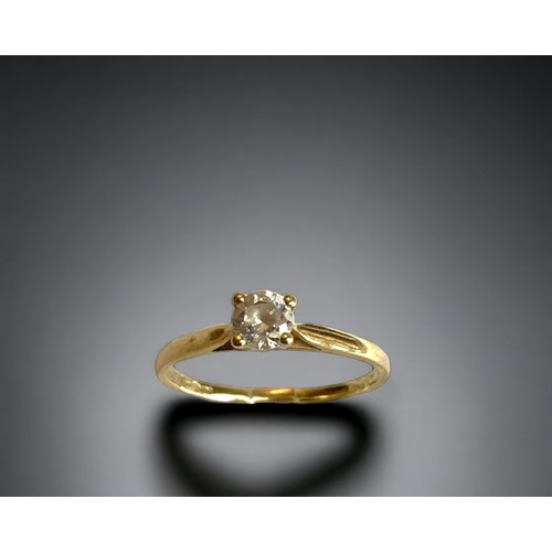 87 - A 9 carat gold and Cubic Zirconia engagement ring. 
Set with a round cut solitaire CZ.
UK Hallmarks.... 