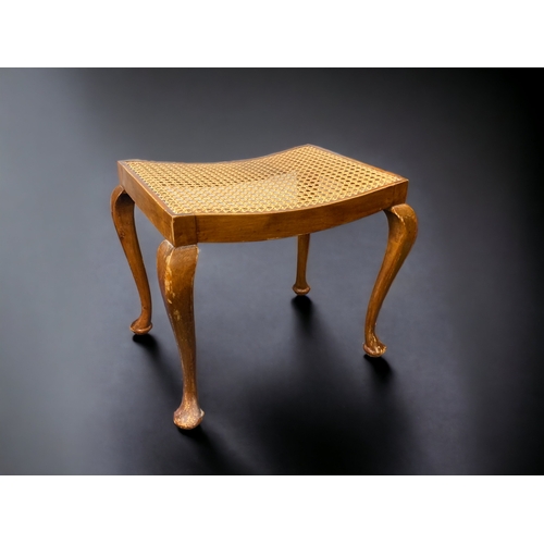 12 - A QUEEN ANNE STYLE CANE SEATED STOOL. 
44CM TALL.