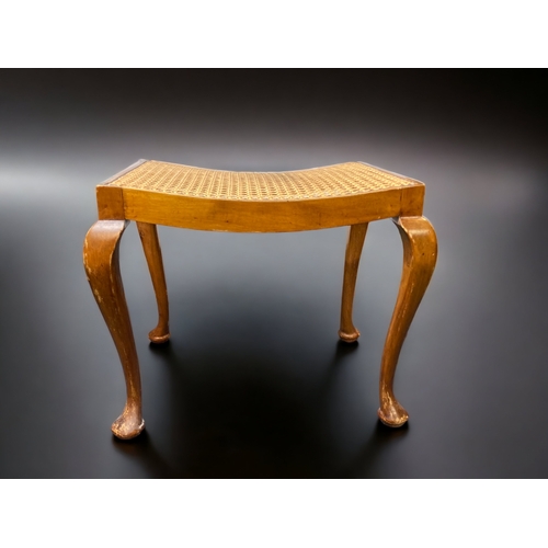 12 - A QUEEN ANNE STYLE CANE SEATED STOOL. 
44CM TALL.
