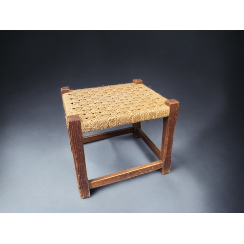 16 - A 19TH CENTURY ELM RUSH SEATED LADDER BACK CHAIR, TOGETHER WITH A RUSH WOVEN FOOTSTOOL. MAKERS MARK ... 