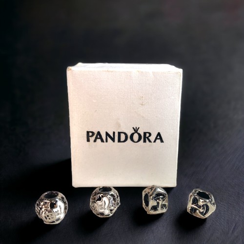 59 - FOUR SILVER PANDORA CHARMS. INCLUDES TWO DISNEY MICKEY MOUSE CHEF EPCOT FOOD & WINE FESTIVAL CHARMS ... 