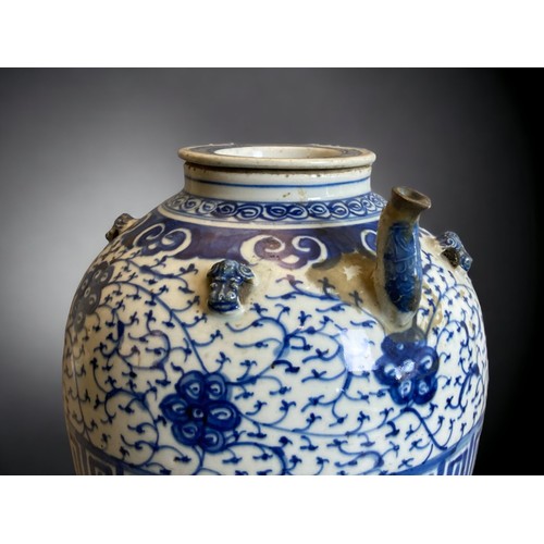 218 - A large Chinese Qing dynasty porcelain Wine / Water pot. 
Hand painted with scrolling stylised bloss... 