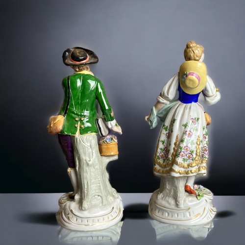 159 - A pair of Sitzendorf hand painted porcelain figures. 
Depicting Flower seller & sweetheart. 
24cm Ta... 