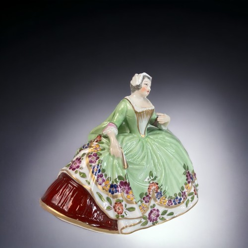 163 - A GERMAN LUDWIGSBURG PORCELAIN FIGURINE.
HAND PAINTED LADY IN PERIOD DRESS. 
10.5 X 13.5 CM