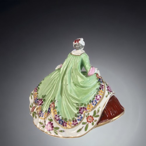 163 - A GERMAN LUDWIGSBURG PORCELAIN FIGURINE.
HAND PAINTED LADY IN PERIOD DRESS. 
10.5 X 13.5 CM