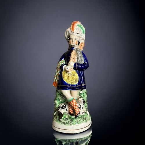 164 - A LARGE PAIR OF 19TH CENTURY STAFFORDSHIRE 'FLOWER SELLERS' FIGURES. TOGETHER WITH A HIGHLANDER. 
TA... 