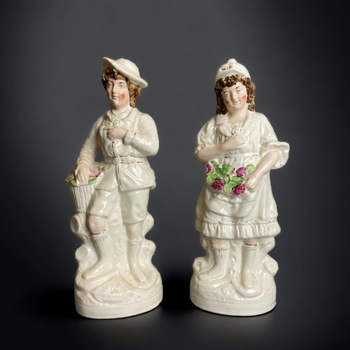 164 - A LARGE PAIR OF 19TH CENTURY STAFFORDSHIRE 'FLOWER SELLERS' FIGURES. TOGETHER WITH A HIGHLANDER. 
TA... 