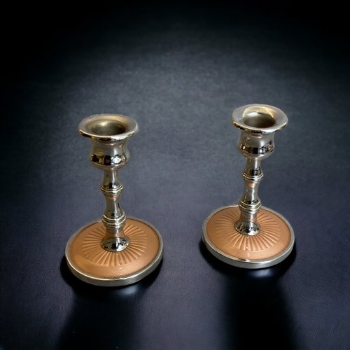 118 - A BOXED 1950's GUILLOCHE STYLE DRESSER BRUSH SET, TOGETHER WITH SIMILAR BRUSH AND CANDLESTICKS.